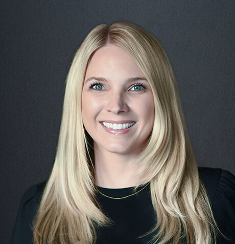 Headshot of Jenna Woods looking at camera.